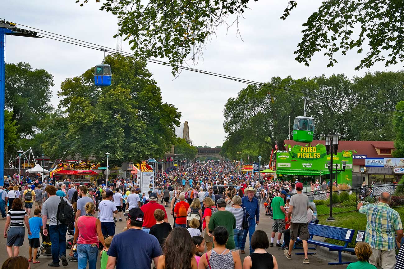 The Minnesota State fair is the largest gathering in Minnesota and millions of people attend during the two week period.