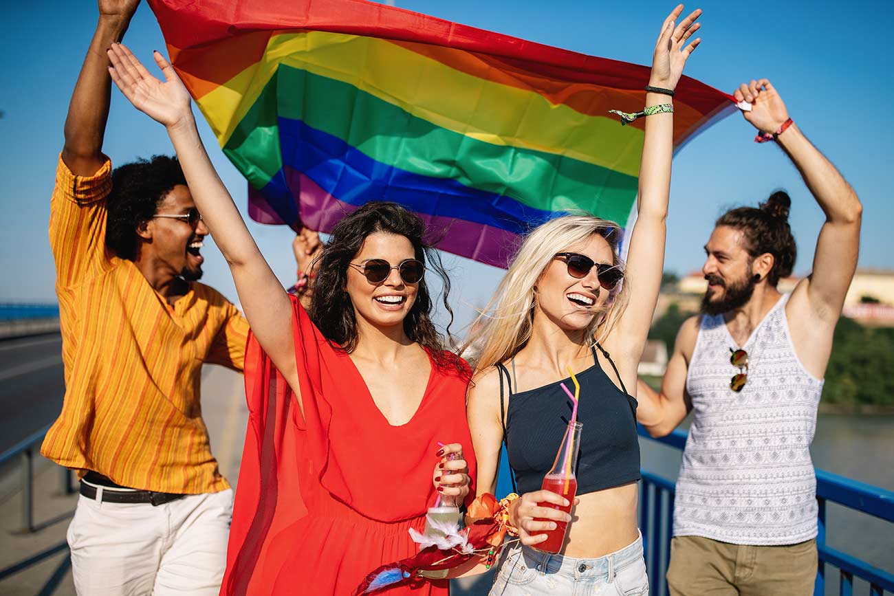 Group of friends attend a gay pride event.