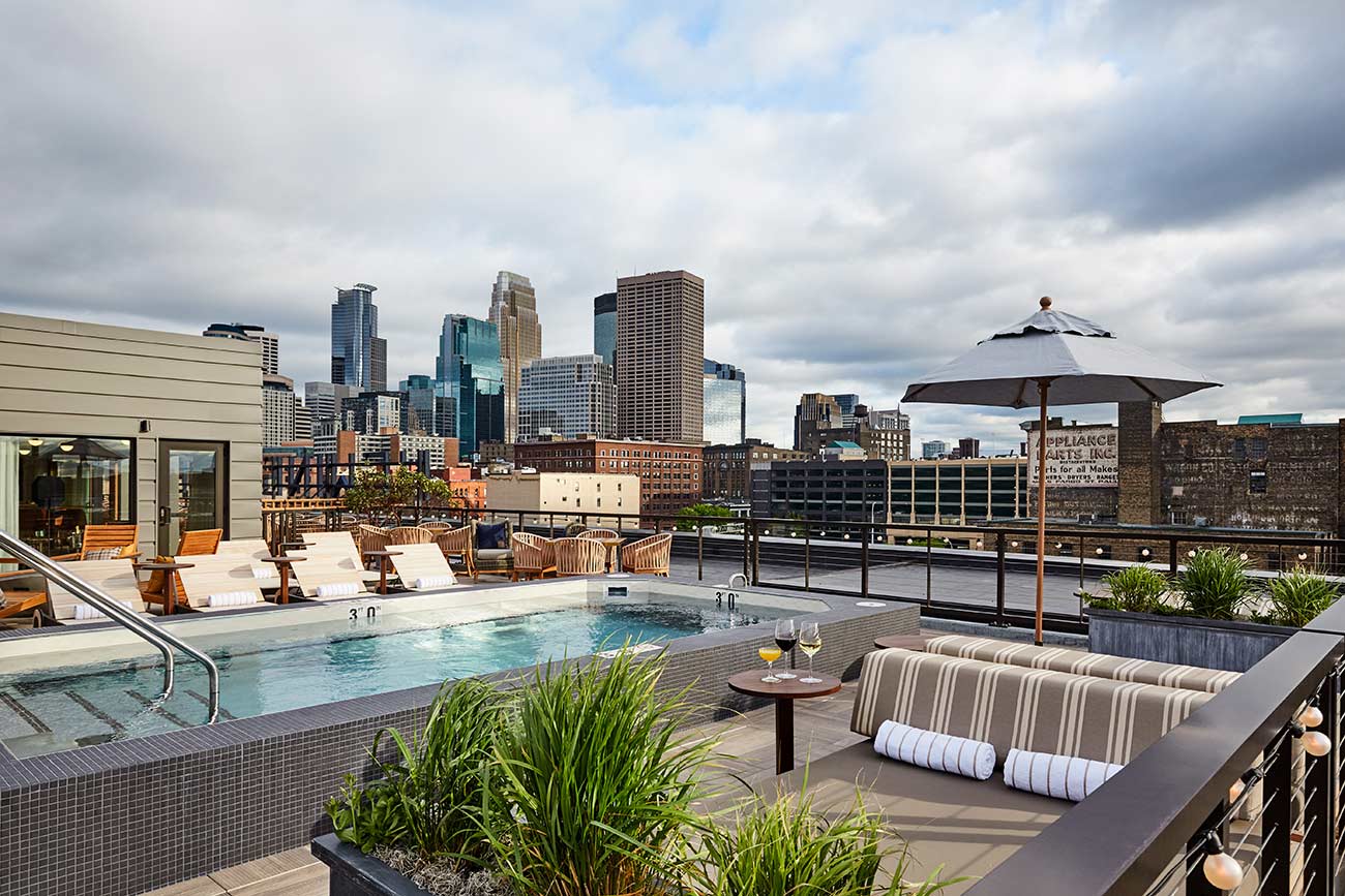 Hewing rooftop during a summer day with the skyline of downtown Minneapolis.