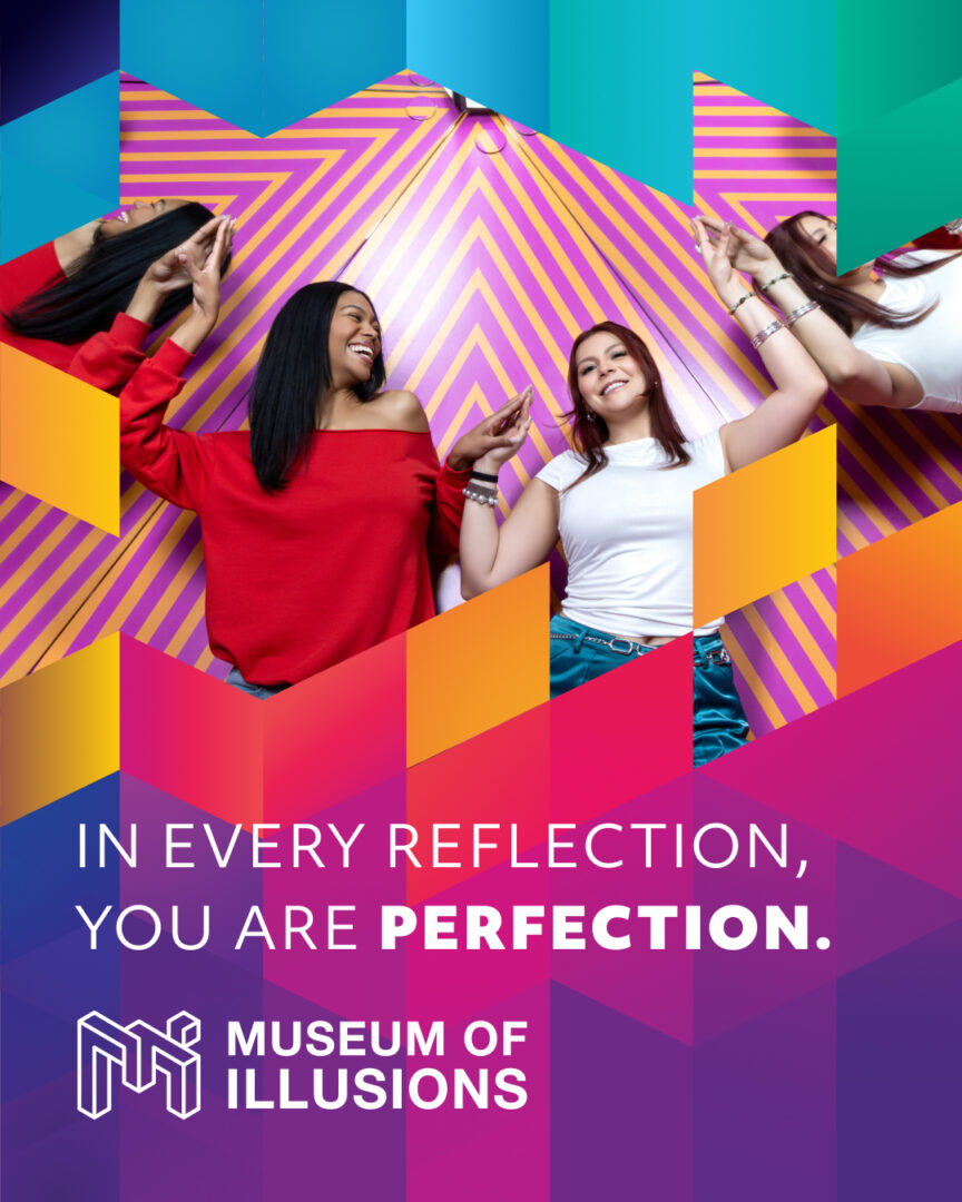Two women celebrating against a brightly colored background for the Museum of Illusions.