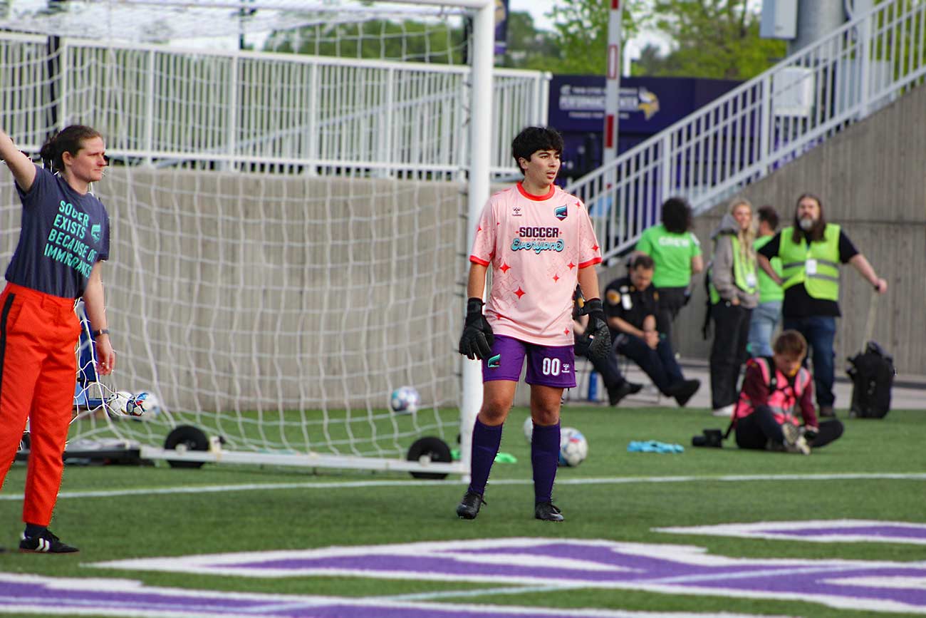 Transgender Goalkeeper Isaac Ranson standing in front of the goal.